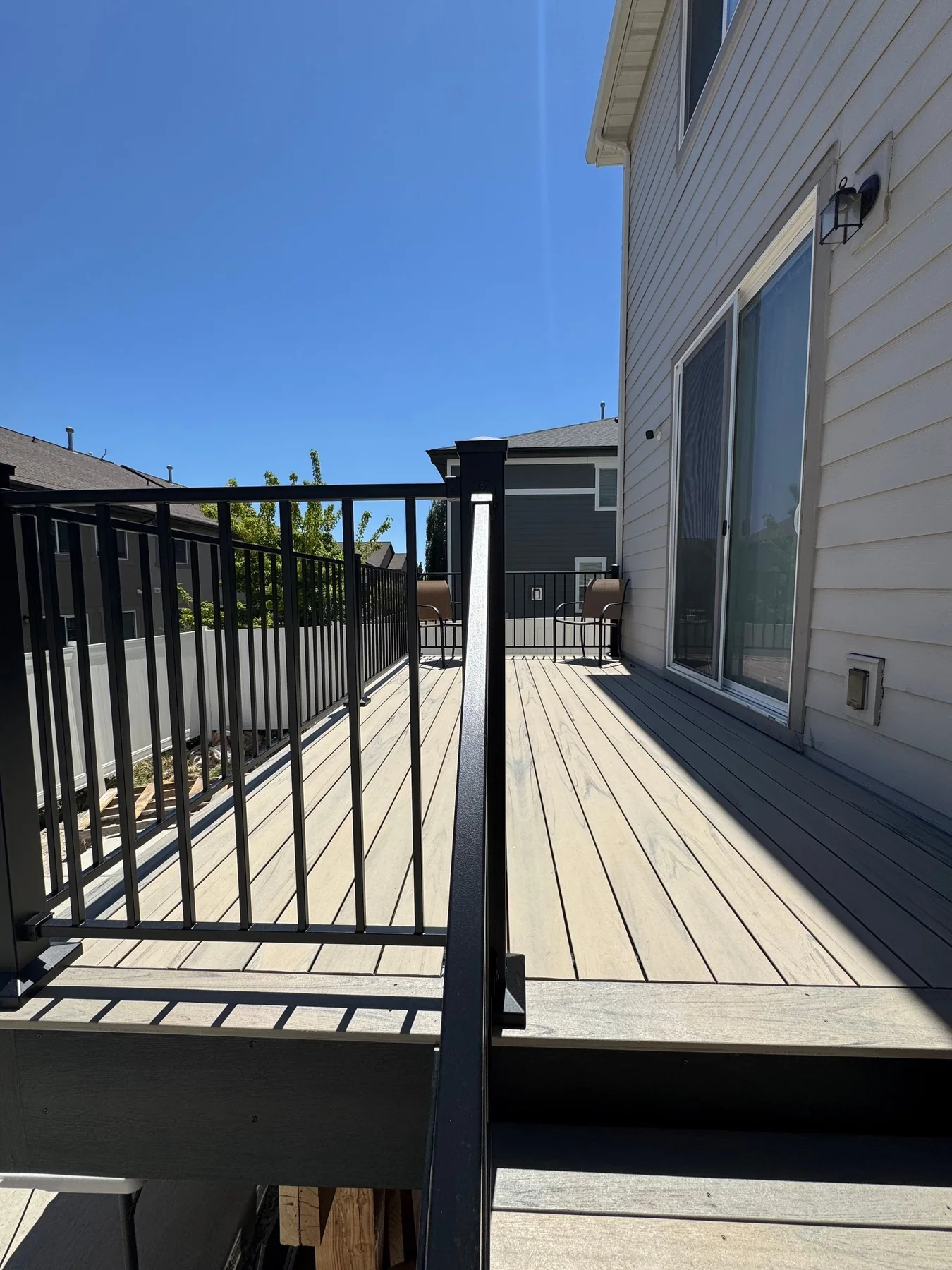 Deck walkway with black railing