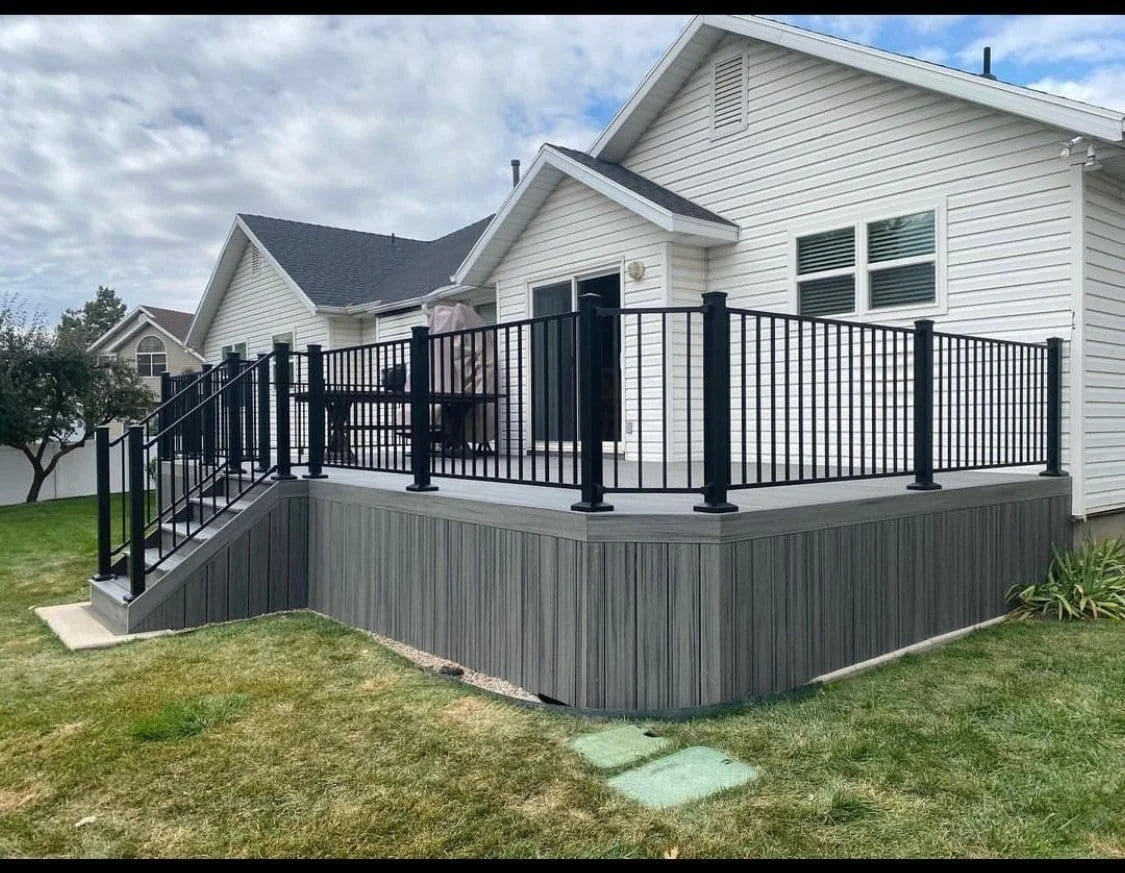 Raised gray composite deck with railing