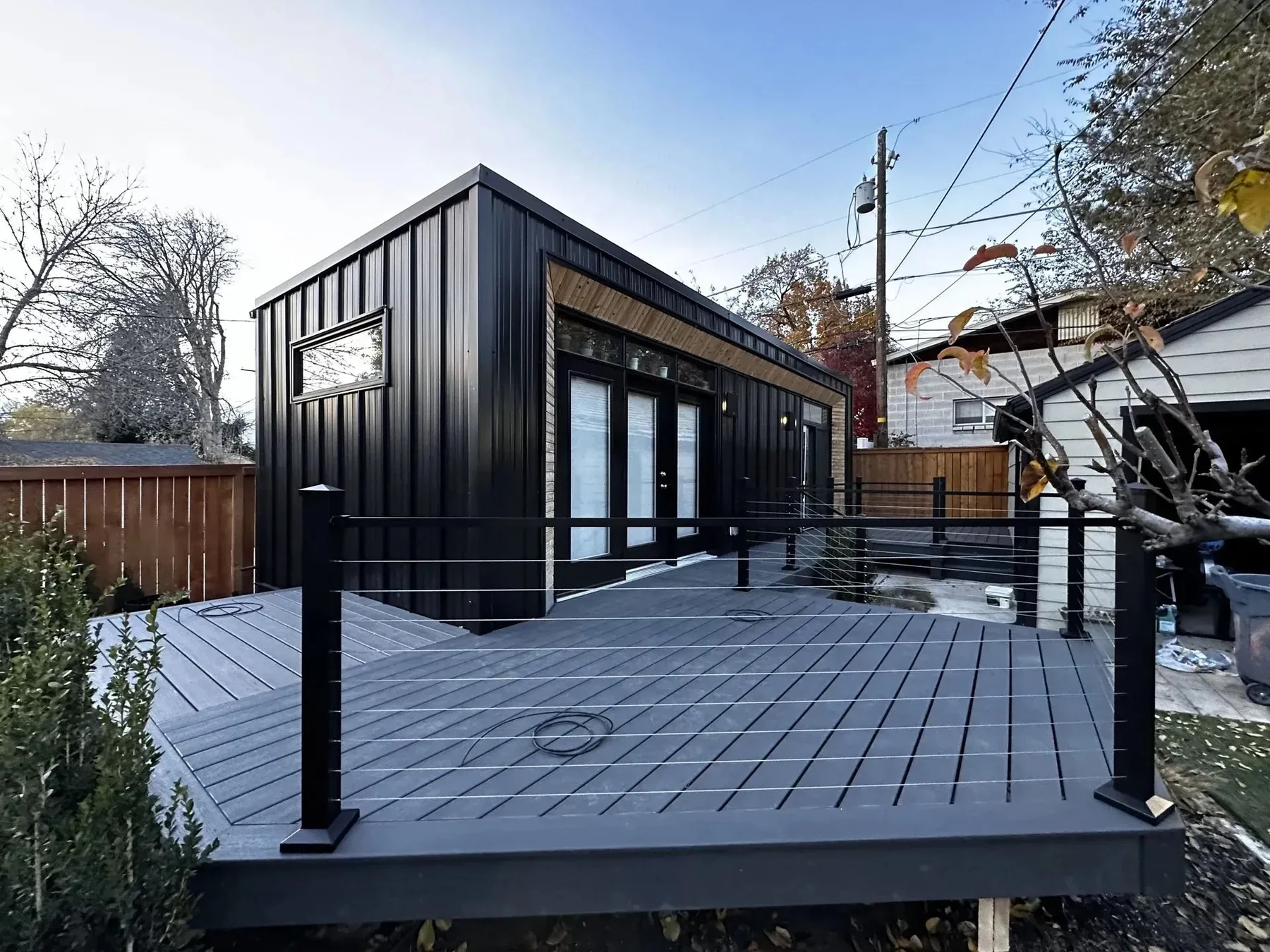 Modern gray deck with dark railing