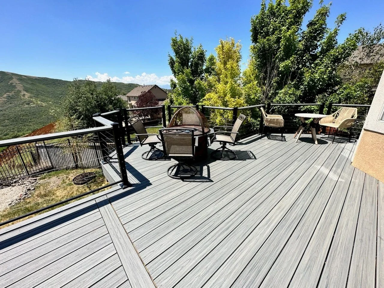 Composite deck with mountain view and dark railing